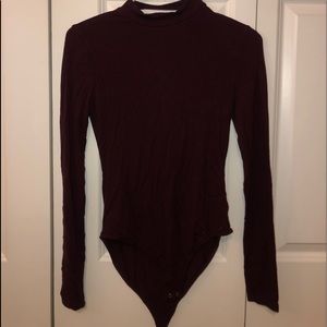 Long sleeve, high necked, body suit